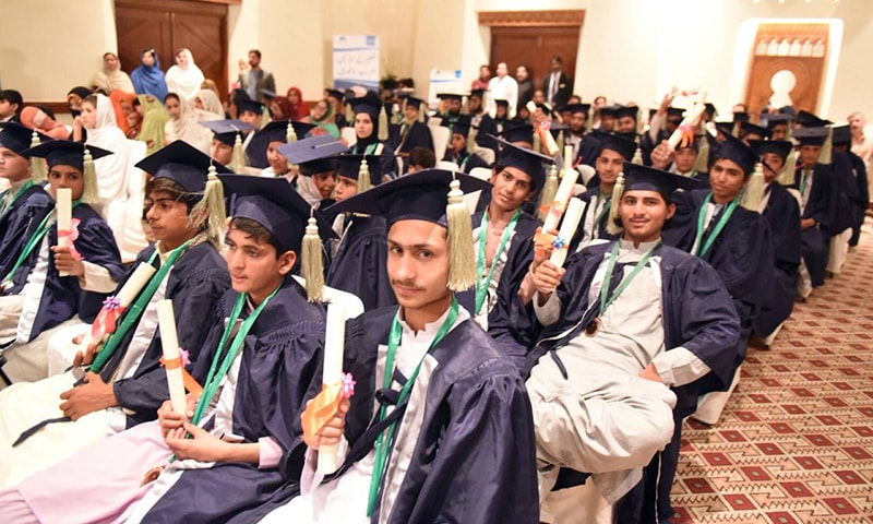 ALP students hold their primary education certificates at a ceremony in Quetta on Friday. — Photo by author