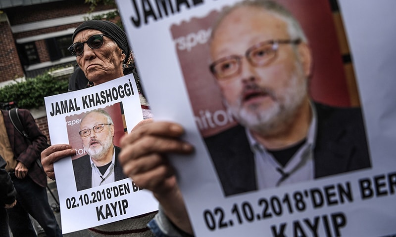 Protesters holding portraits of missing journalist and Riyadh critic Jamal Khashoggi with the caption: "Jamal Khashoggi is missing since October 2". —AFP