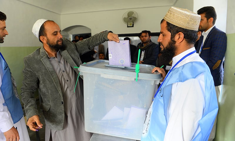 An Afghan voter casts his ballot at a polling centre for the country's legislative election in Herat province. — AFP