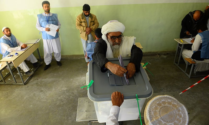 An Afghan voter casts his ballot at a polling centre for the country's legislative election in Herat province. — AFP