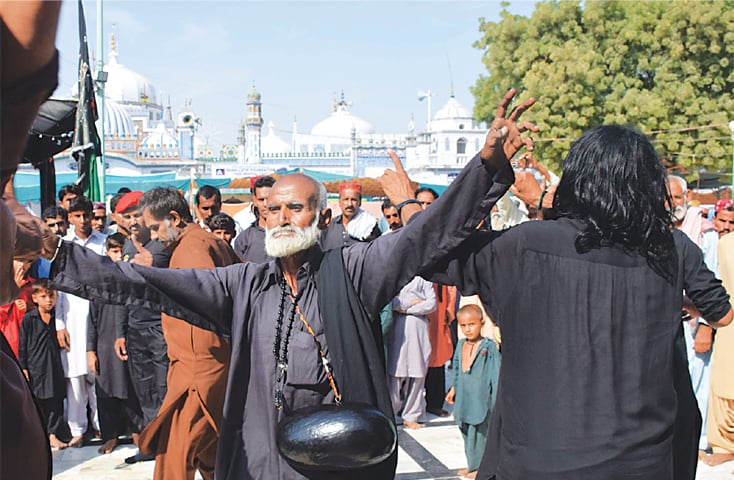 Bhitshah: Devotees perform dhamal at the dargah of Shah Abdul Latif Bhitai on Wednesday, the first day of the saint’s urs.—Dawn