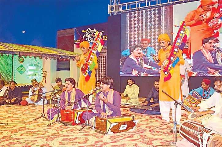 ARTISTS present Bhitai&rsquo;s verses at a music programme at his shrine in Bhitshah on the second day of the three-day urs on Thursday.&mdash;PPI