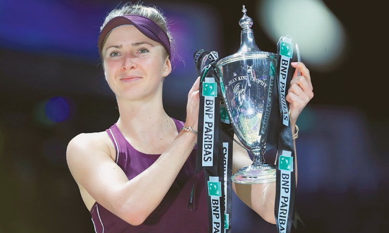 Ukraine&rsquo;s Elina Svitolina celebrates with her winning trophy after defeating Sloane Stephens of the US at the WTA Finals on Sunday.&mdash;AP