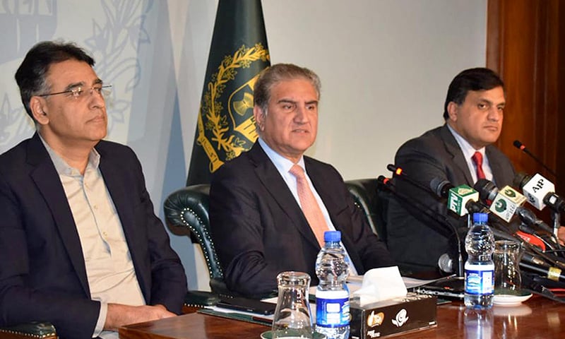 Finance Minister Asad Umar and Foreign Minister Shah Mehmood Qureshi addressing a press conference at the Foreign Office. Foreign Office Spokesperson Dr Mohammad Faisal is also present. —APP