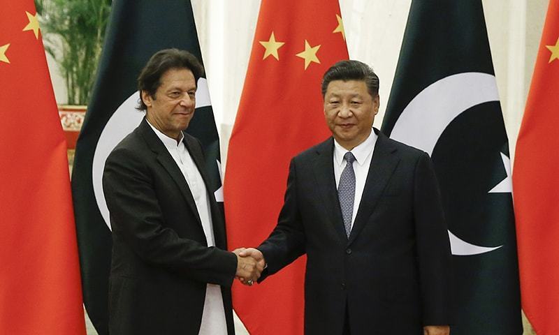 Chinese President Xi Jinping (R), meets Prime Minister Imran Khan at the Great Hall in Beijing earlier this month. — AP/File