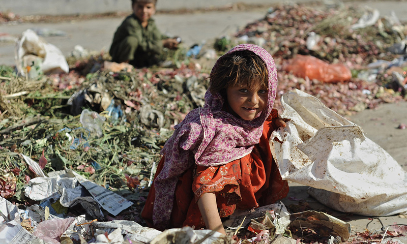 Children scavenge through the garbage in this file photo.