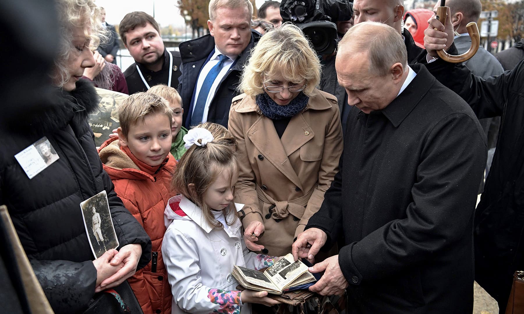 Russian President Vladimir Putin (R) meets with descendants of WWI participants after the flower-laying ceremony marking the centenary of the Armistice Day, at the Monument to Soldiers of the Russian Expeditionary Force Who Fought in France in WWI, in Paris on November 11, 2018. —AFP Russian President Vladimir Putin (R) meets with descendants of WWI participants after the flower-laying ceremony marking the centenary of the Armistice Day, at the Monument to Soldiers of the Russian Expeditionary Force Who Fought in France in WWI, in Paris on November 11, 2018. —AFP