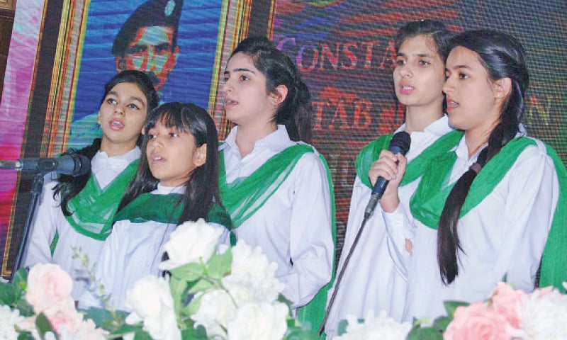Schoolchildren sing a song during a ceremony held to pay tributes to martyrs of Islamabad police at the Police Lines Headquarters on Monday. — APP Schoolchildren sing a song during a ceremony held to pay tributes to martyrs of Islamabad police at the Police Lines Headquarters on Monday. — APP