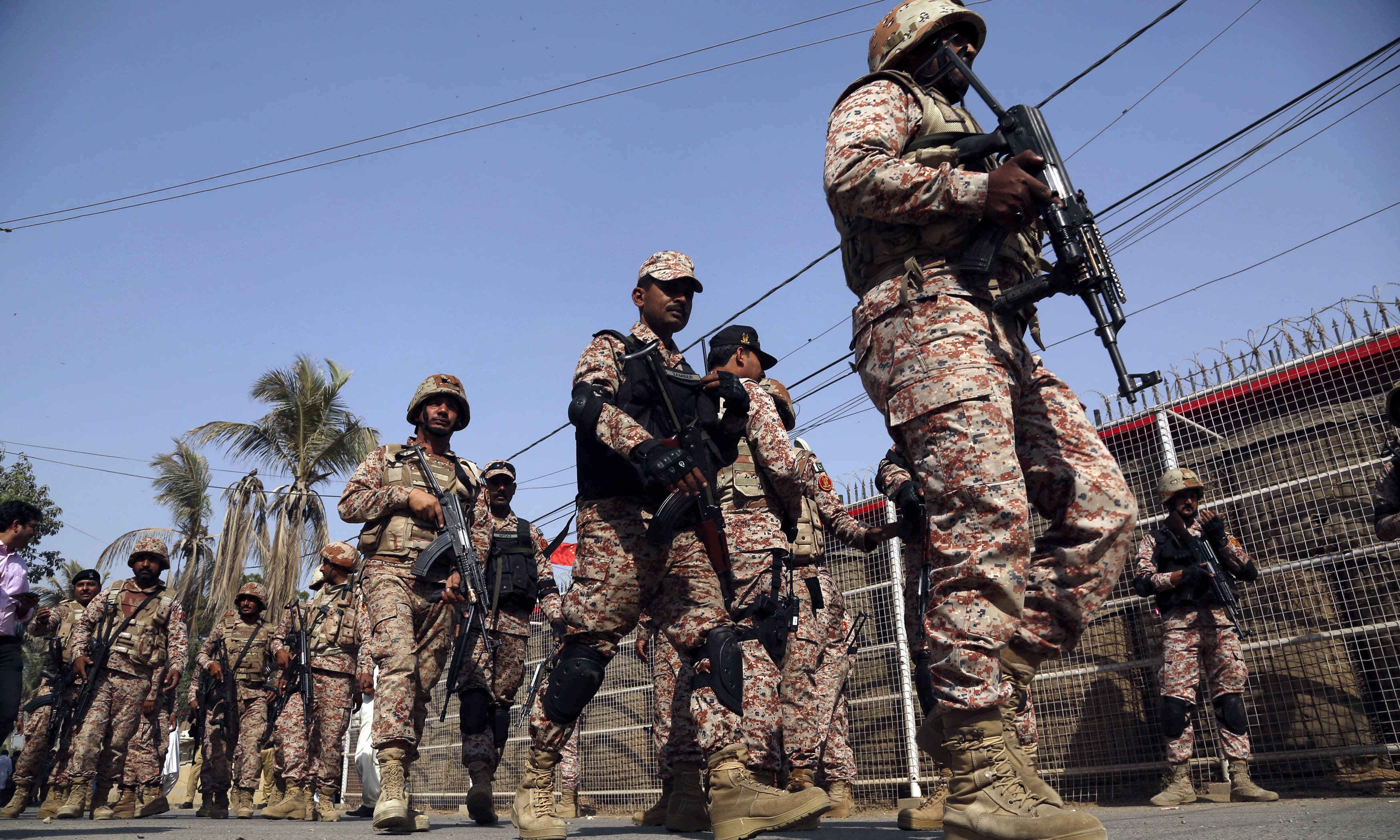 Rangers personnel move in the compound of Chinese Consulate in Karachi. —AP