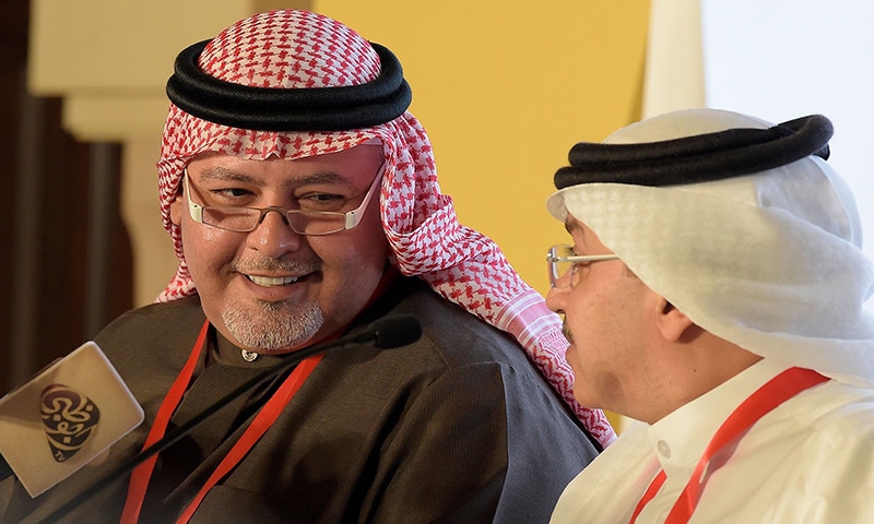 Bahrain's Minister of Justice and Islamic Affairs Shaikh Khalid bin Ali al-Khalifa (L) speaks with Municipal Elections executive director Nawaf Hamza (R) during a press conference in the capital Manama on November 23. &mdash; AFP