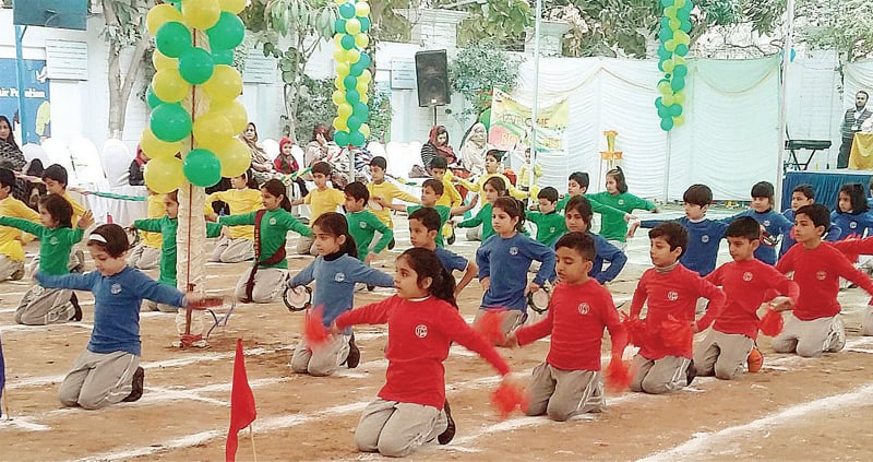 Students of a private school present PT show at a function in Hayatabad, Peshawar, on Tuesday. &mdash; Dawn