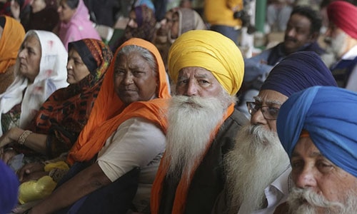 Visiting Indian Sikh pilgrims attend a ceremony in Kartarpur on November 28, 2018.—AP