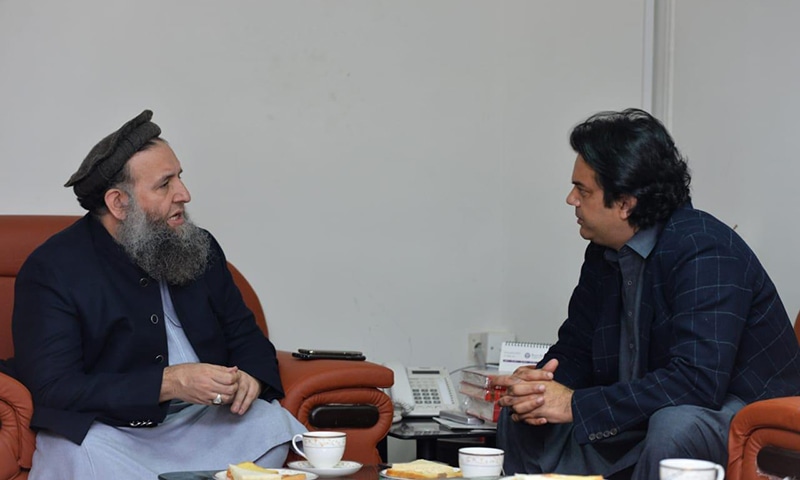 Minister for Religious Affairs Noorul Haq Qadri (L) and prime minister's aide Usman Dar (R)  discuss measures to include religious seminaries' students in youth programme. — Photo by author