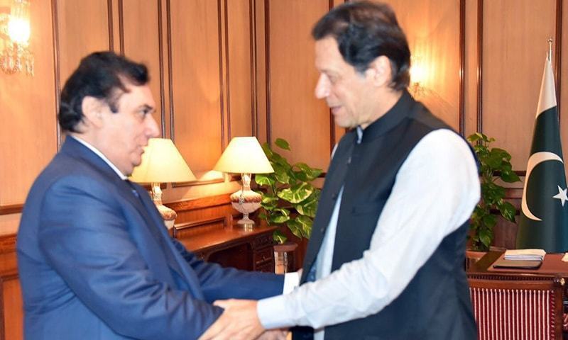 NAB chairman Javed Iqbal in a meeting with PM Imran Khan in August. — File photo/PM Office