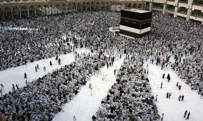 Pilgrims sit and circumambulate around the Kaaba ahead of the annual Haj pilgrimage in Makkah. —AFP