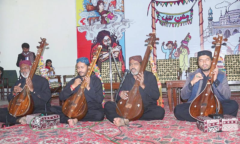 ARTISTS perform during the Jashn-i-Latif programme at Sindh Museum on Sunday.&mdash;APP