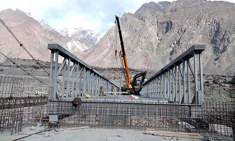 GILGIT: Labourers carry out work on an under construction bridge in Kachura. Releases for Azad Jammu and Kashmir and Gilgit-Baltistan under the PSDP have been higher this year.—APP