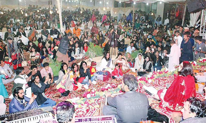 AN artist entertains the audience at the Shaikh Ayaz festival at Sindh Museum on Saturday.&mdash;PPI