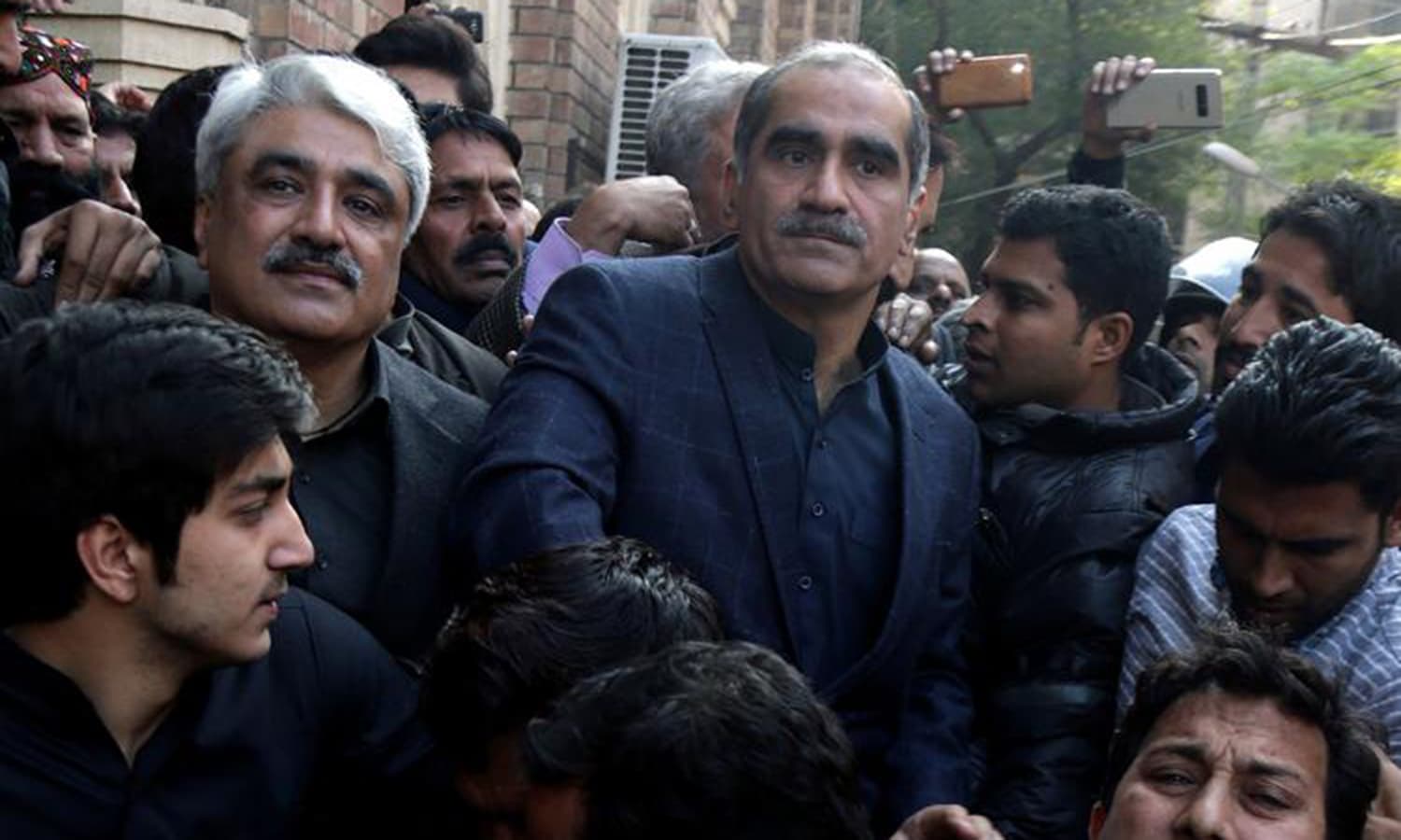 Khawaja Saad Rafque (R) and brother Khawaja Salman Rafique (L) arrested by NAB authorities in Paragon Housing Society scam. — AP