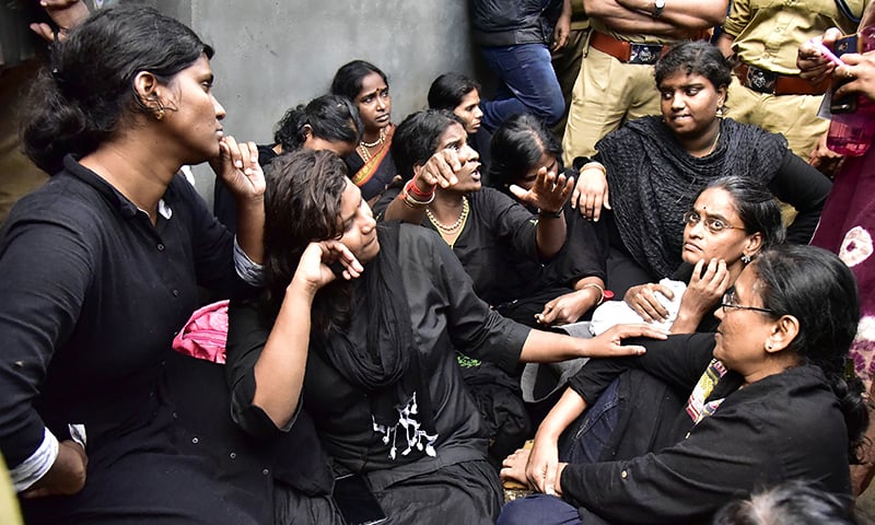 India women activist from a 'Manithi' NGO gesture as they arrive to start their treck to Sabarimala Ayyappa temple.&mdash;AFP
