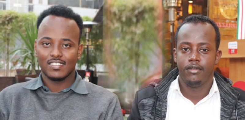 Secretary General of the African Students Association in Islamabad Mohamed Abdi Warsame from Puntland, Somalia, and Somalia Community Association Chairman Ali Amin Mohamed pose for a photograph.