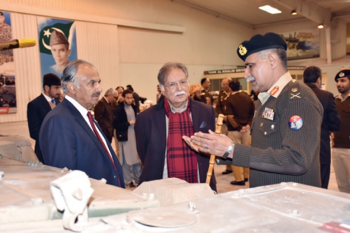 The members of Senate Standing Committee on Defence Production being briefed about the production capacity during their visit to Heavy Industries Taxila on Thursday. — Dawn