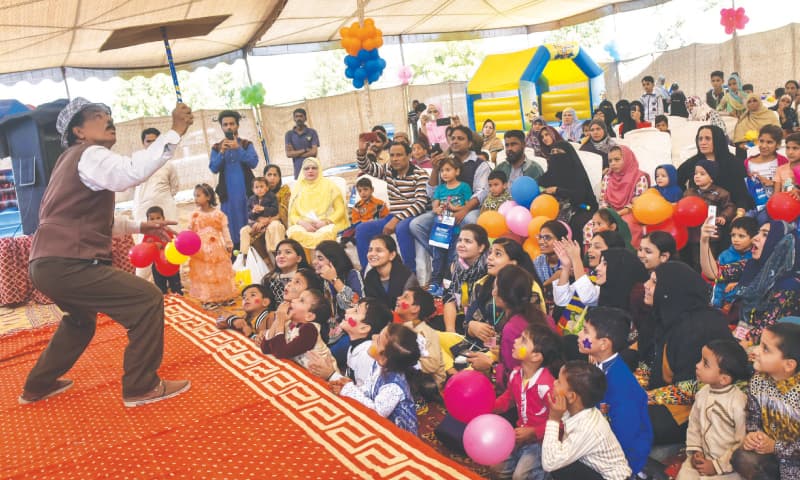 A magician entertains children and their elders at the event held at the Indus Hospital on Saturday.&mdash;Fahim Siddiqi / White Star