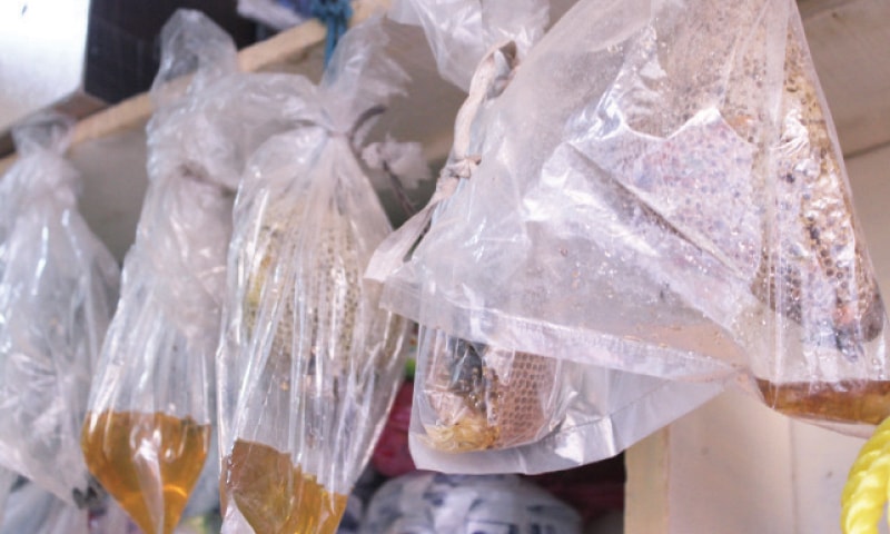 Beehives on sale in a Kohat market. — Dawn