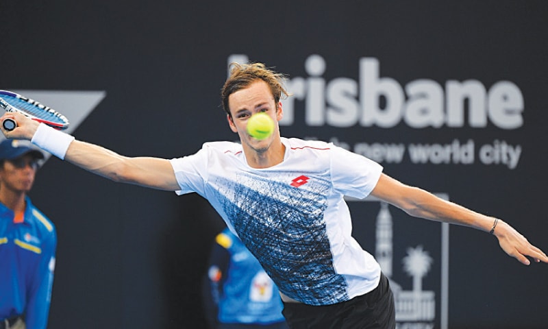 BRISBANE: Daniil Medvedev of Russia hits a return to Canada’s Milos Raonic during their quarter-final at the Brisbane International on Friday.—AFP BRISBANE: Daniil Medvedev of Russia hits a return to Canada’s Milos Raonic during their quarter-final at the Brisbane International on Friday.—AFP