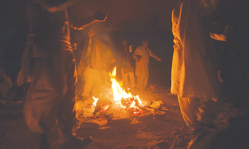 Dancing around the camp fire. / Photos by Fahim Siddiqi / White Star
