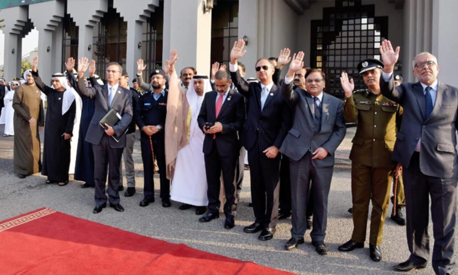 Minister for Energy Omar Ayub Khan waves goodbye to UAE's crown prince upon his departure at Nur Khan airbase. — Photo: PTI Twitter