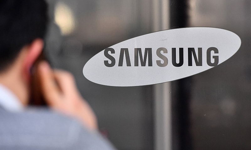 The logo of Samsung Electronics is seen on a glass door at the Samsung building in Seoul on January 8, 2019. &mdash; AFP