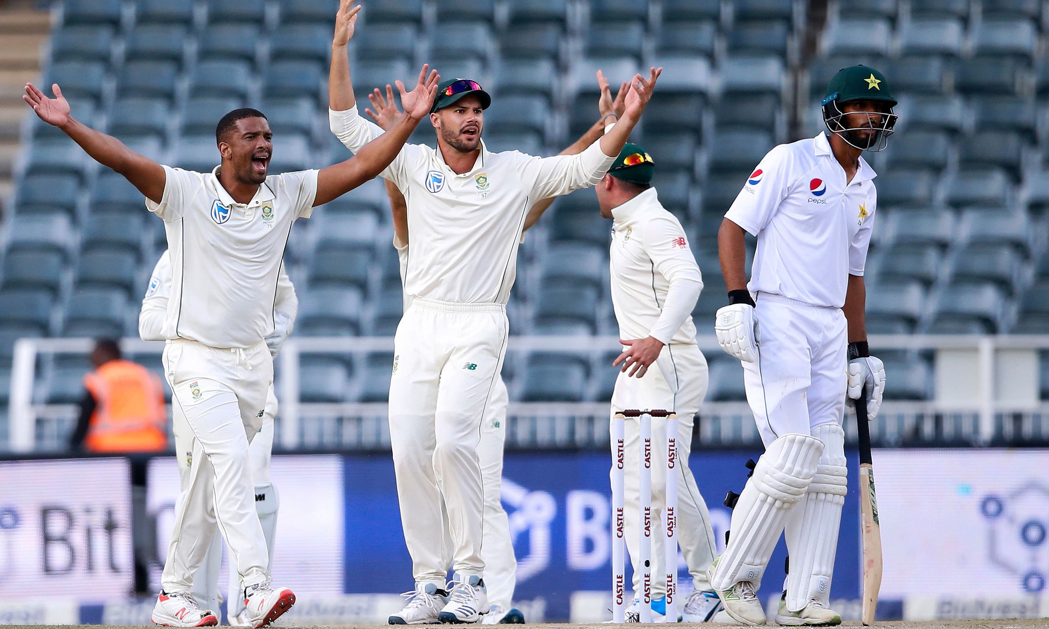South Africa's Vernon Philander celebrates the dismissal of Shan Masood during the first day of the third Test. &mdash;AFP