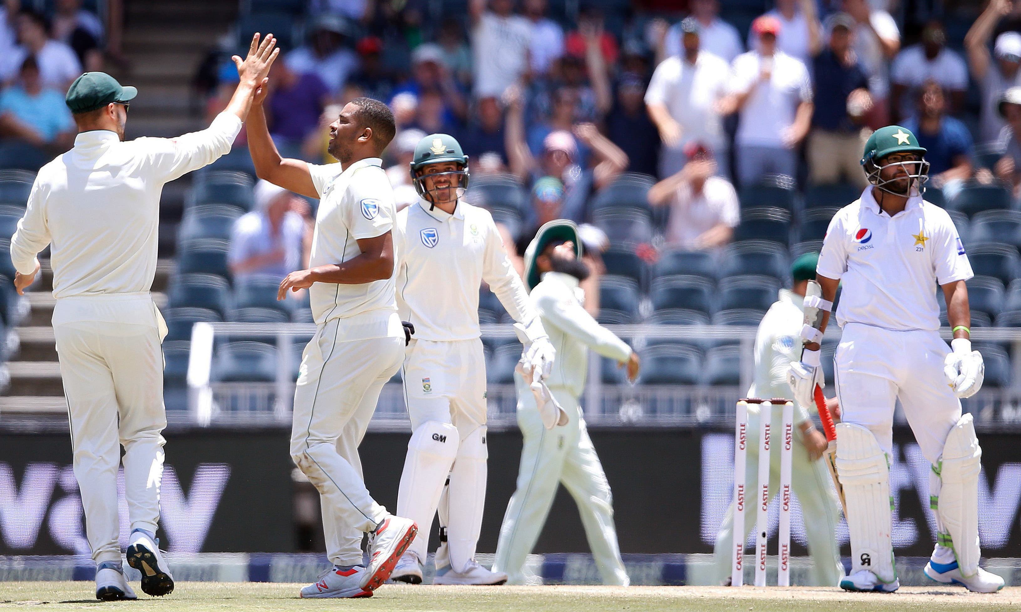 Vernon Philander celebrates with teammates the dismissal of Imamul Haq during the second day of the third Test. —AFP Vernon Philander celebrates with teammates the dismissal of Imamul Haq during the second day of the third Test. —AFP