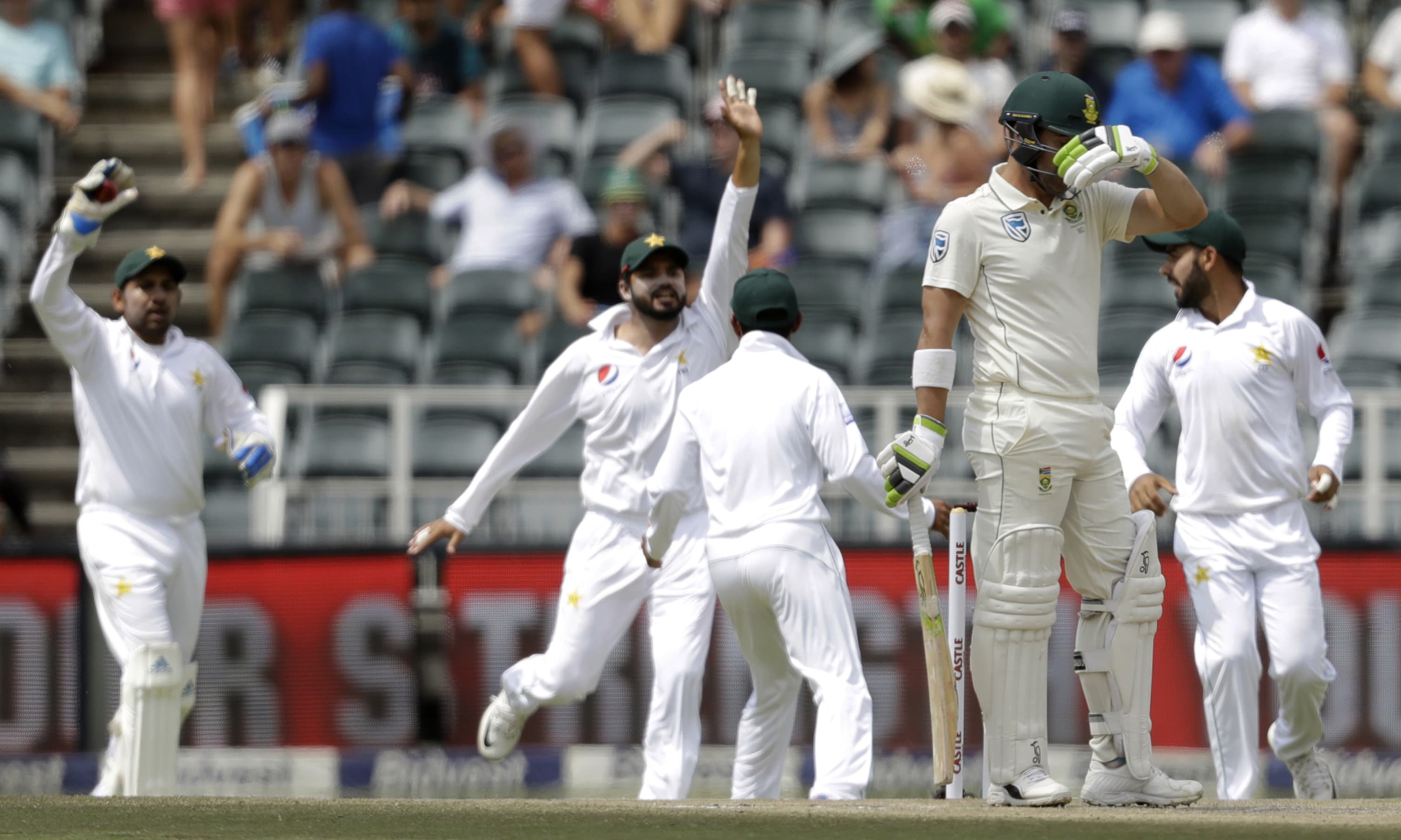 South Africa's batsman Dean Elgar reacts as Pakistan players celebrates his wicket. —AP South Africa's batsman Dean Elgar reacts as Pakistan players celebrates his wicket. —AP