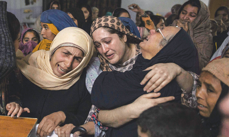 Relatives of an Army Public School victim grieve in the aftermath of the carnage. — File