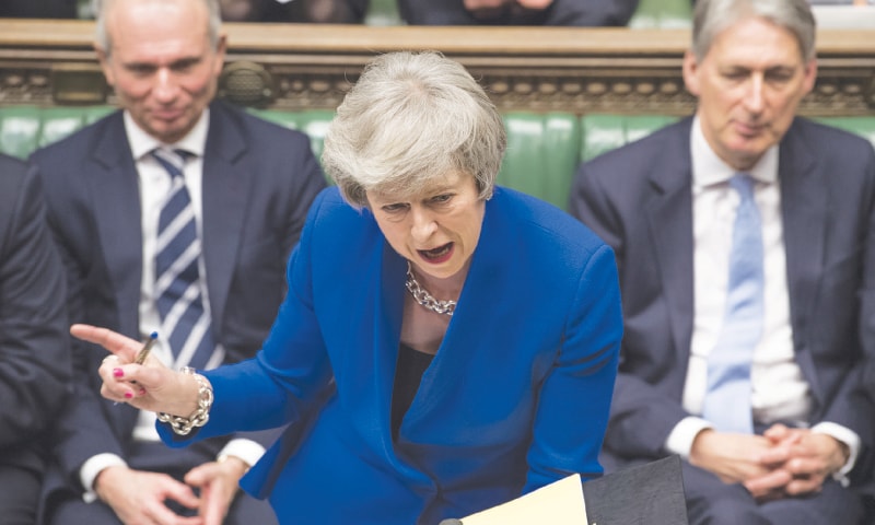 PRIME Minister Theresa May speaks during a debate before a no-confidence vote in the House of Commons on Wednesday.—AP