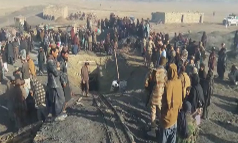 People gather outside the landmine where an explosion took place on Monday morning. — DawnNewsTV