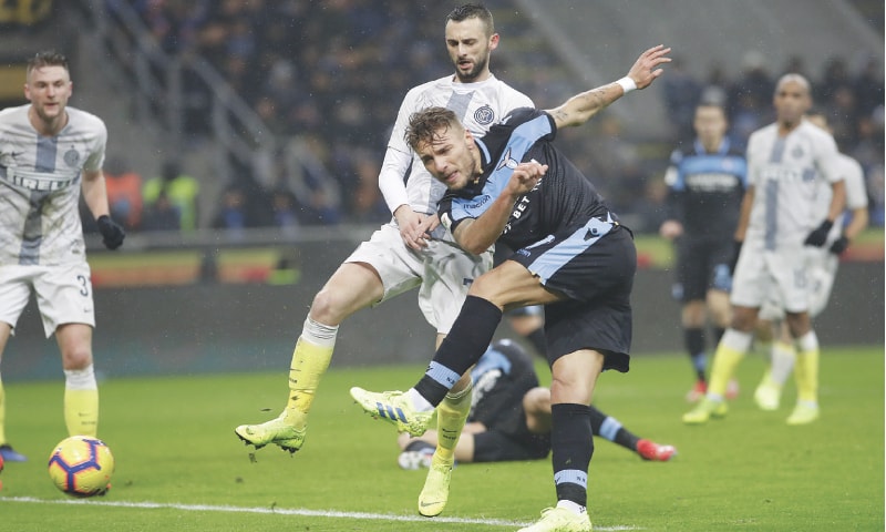 MILAN: Lazio’s Ciro Immobile shoots on goal during the Coppa Italia quarter-final against Inter Milan at the San Siro.—AP MILAN: Lazio’s Ciro Immobile shoots on goal during the Coppa Italia quarter-final against Inter Milan at the San Siro.—AP