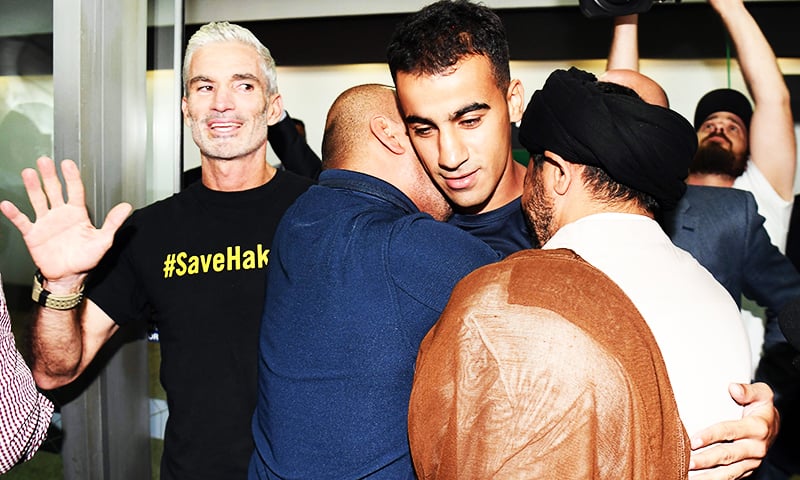 Supporters receive footballer Hakeem al-Araibi upon his arrival at the airport in Melbourne.— AFP