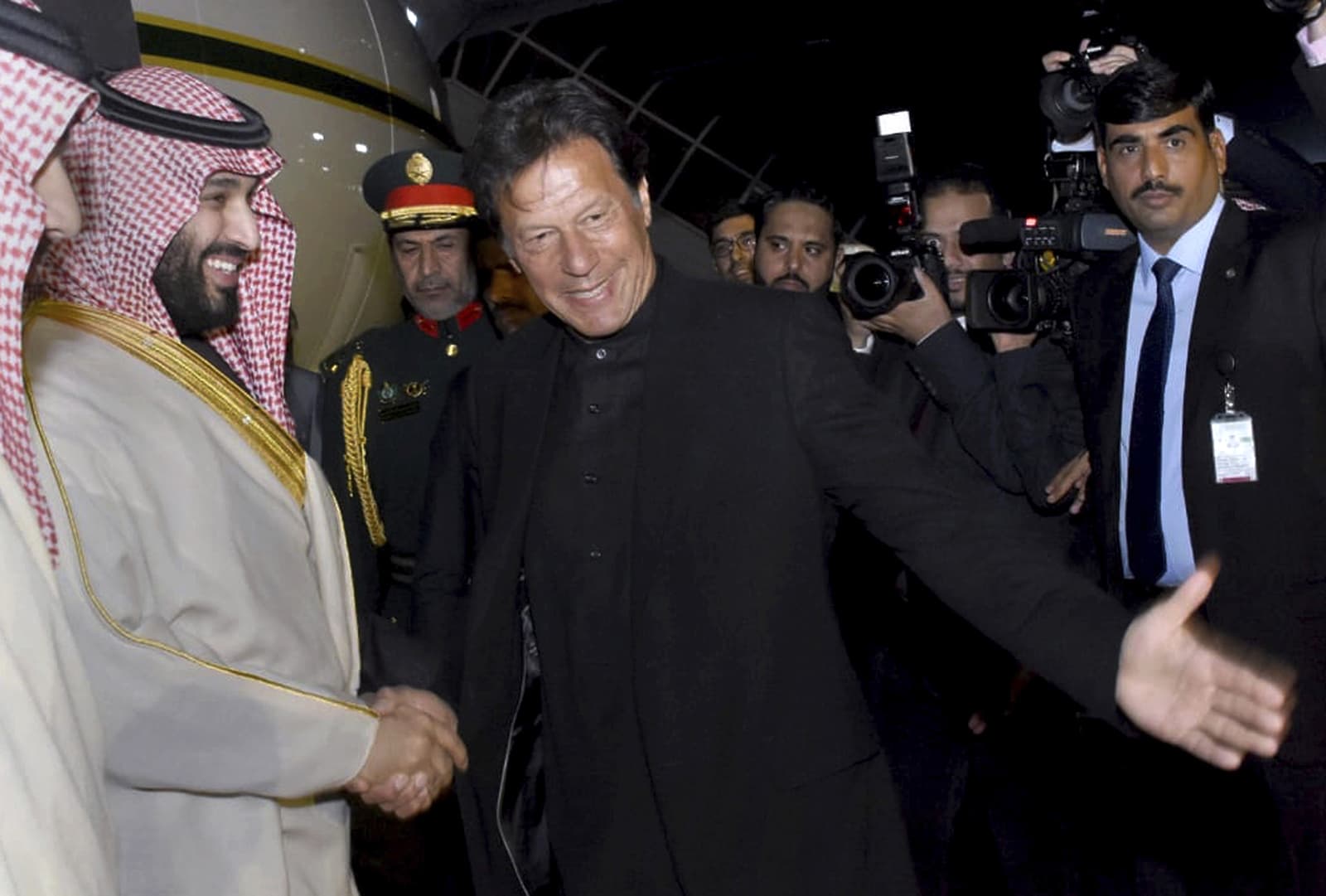 Prime Minister Imran Khan greets Saudi Arabia's Crown Prince Mohammed bin Salman upon his arrival at Nur Khan Airbase in Rawalpindi on Sunday. — AP