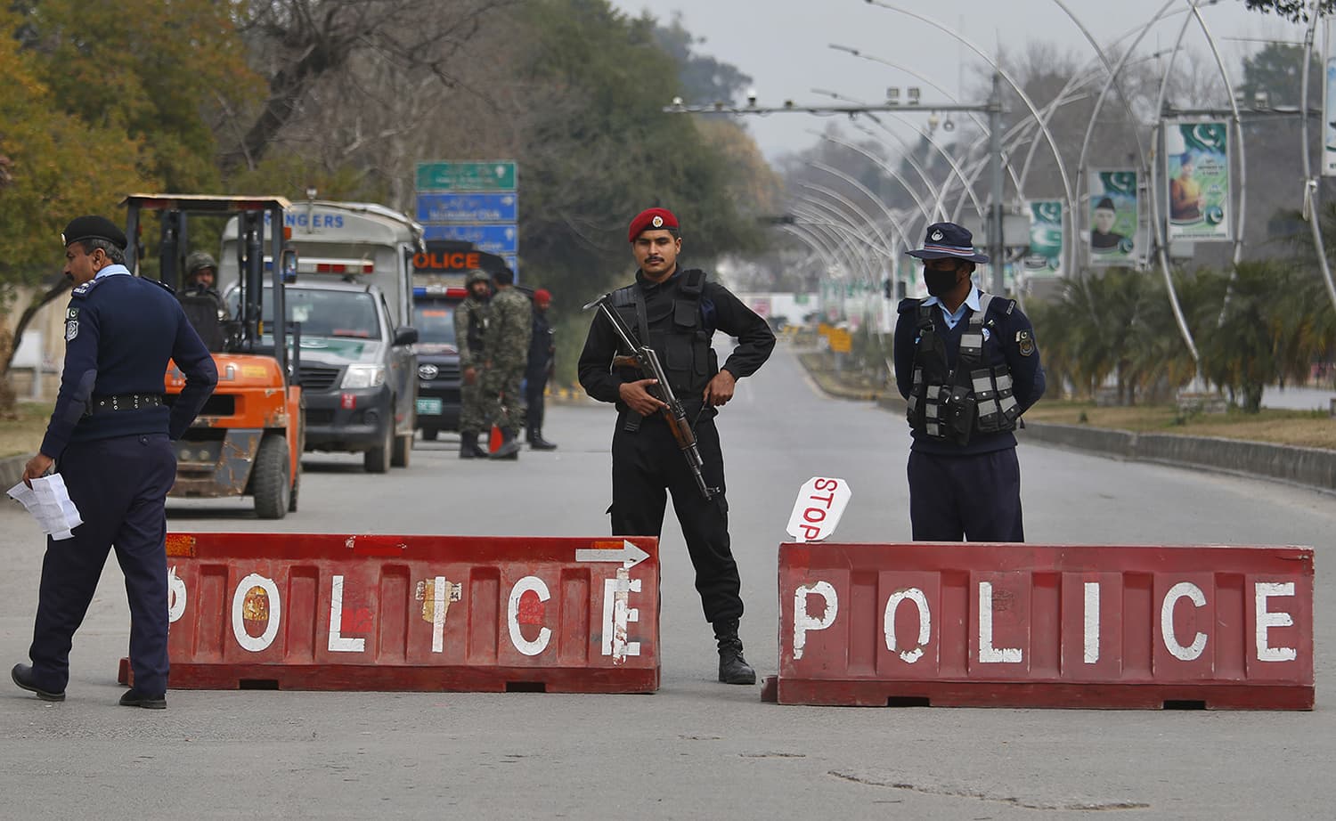 Pakistani police commandos and paramilitary soldiers stand guard at a highway to ensure security ahead of Saudi Arabia's crown prince visit to Pakistan, in Islamabad on Sunday. — AP