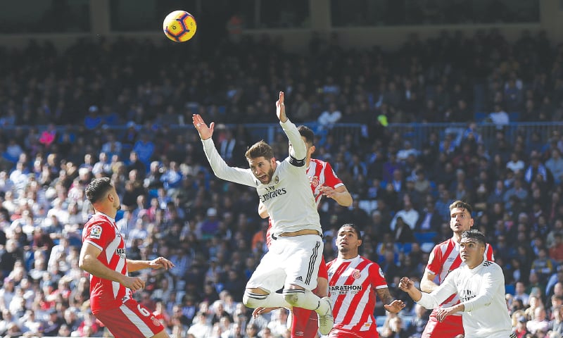 MADRID: Real Madrid’s Sergio Ramos gestures after heading the ball during the La Liga match against Girona at the Santiago Bernabeu Stadium.—AP MADRID: Real Madrid’s Sergio Ramos gestures after heading the ball during the La Liga match against Girona at the Santiago Bernabeu Stadium.—AP