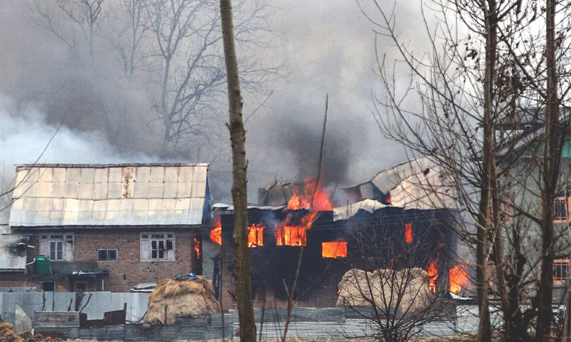 A HOUSE in Pulwama in which Kashmiri fighters were suspected to have sheltered is in flames after the gunfight on Monday.—AFP