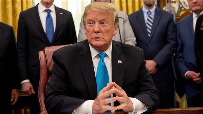 President Donald Trump pauses during a signing event for "Space Policy Directive 4" in the Oval Office of the White House on Tuesday. — AFP