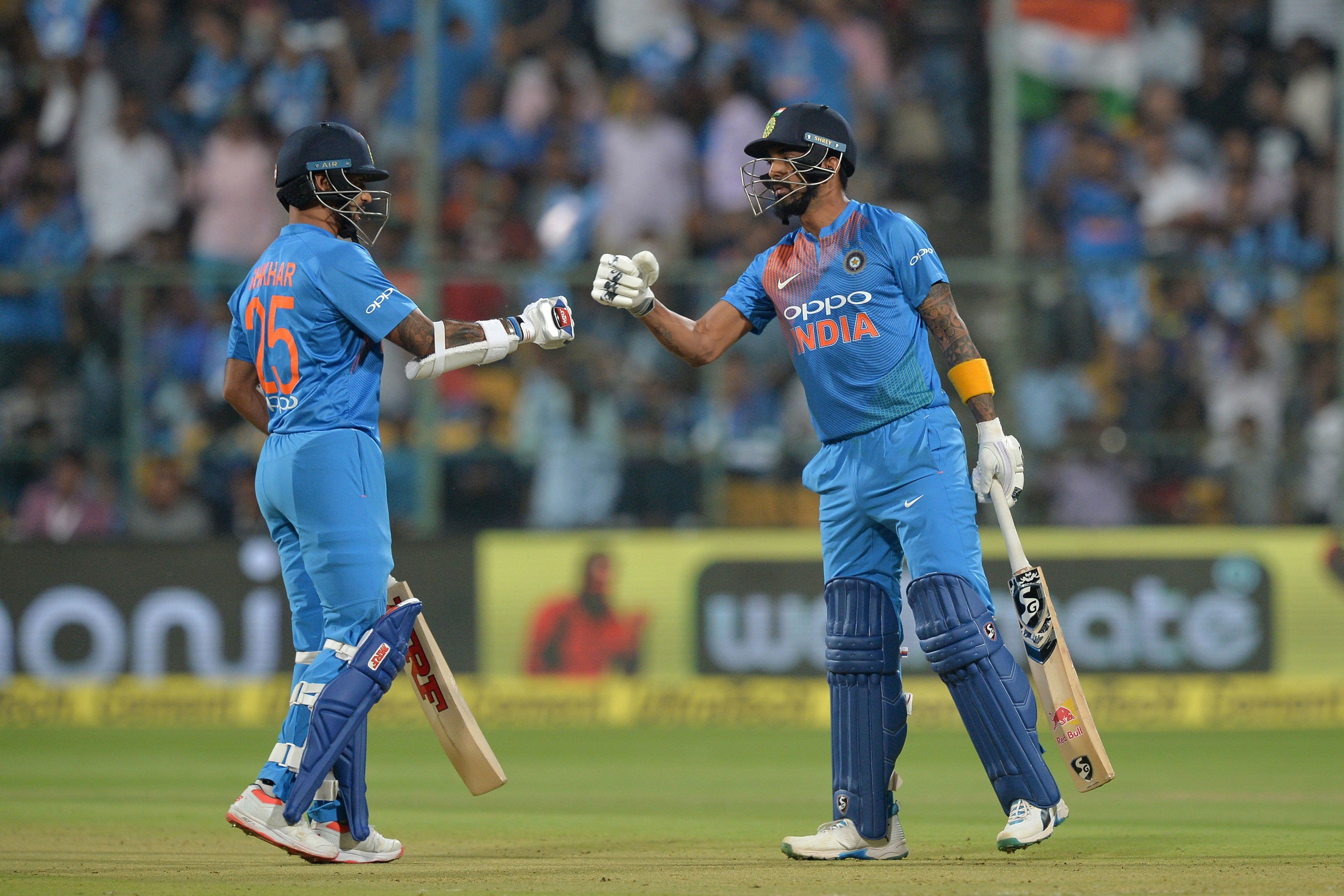 Indian batsmen K.L. Rahul (R) and Shikhar Dhawan pump fists during the second Twenty20 international cricket match between India and Australia.&mdash;AFP