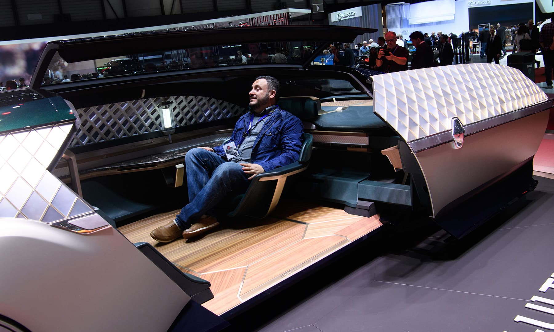 A visitor sits in the Renault EZ-ULTIMO concept car in Geneva. &mdash; AFP