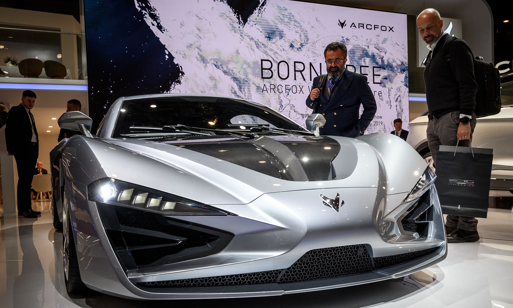 Visitors look at the Arcfox-GT model car at the booth of the Chinese carmaker on March 5 ahead of the Geneva International Motor Show. &mdash; AFP