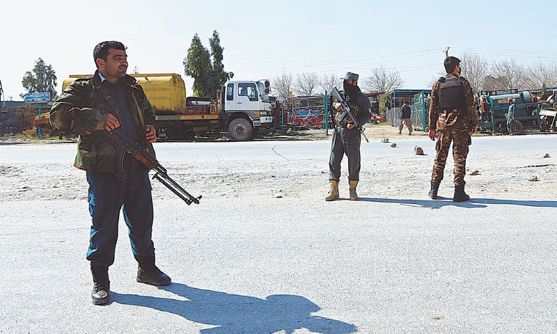 MEMBERS of Afghan security forces stand guard near the site of the suicide attack.&mdash;Reuters