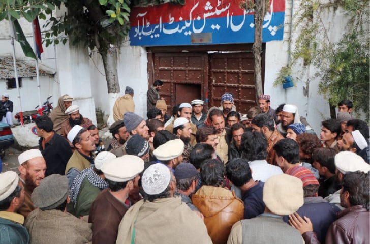 Protesters gather outside Abbottabad Cantt police station on Thursday. —Online